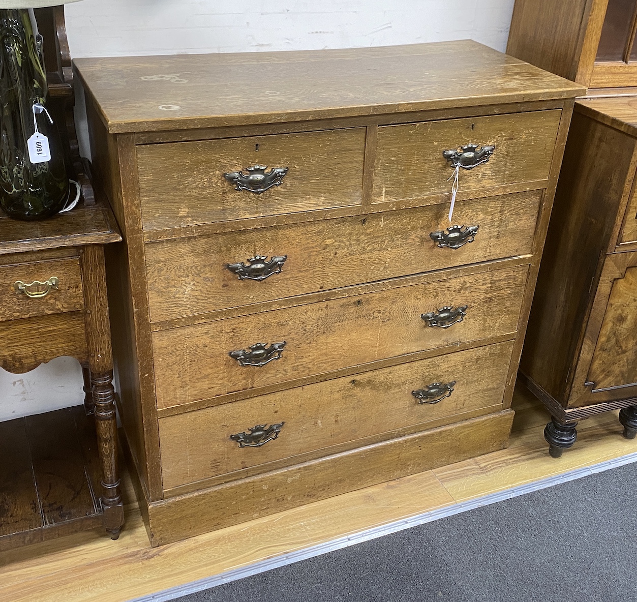 An Edwardian oak chest of drawers, width 105cm, depth 48cm, height 106cm
